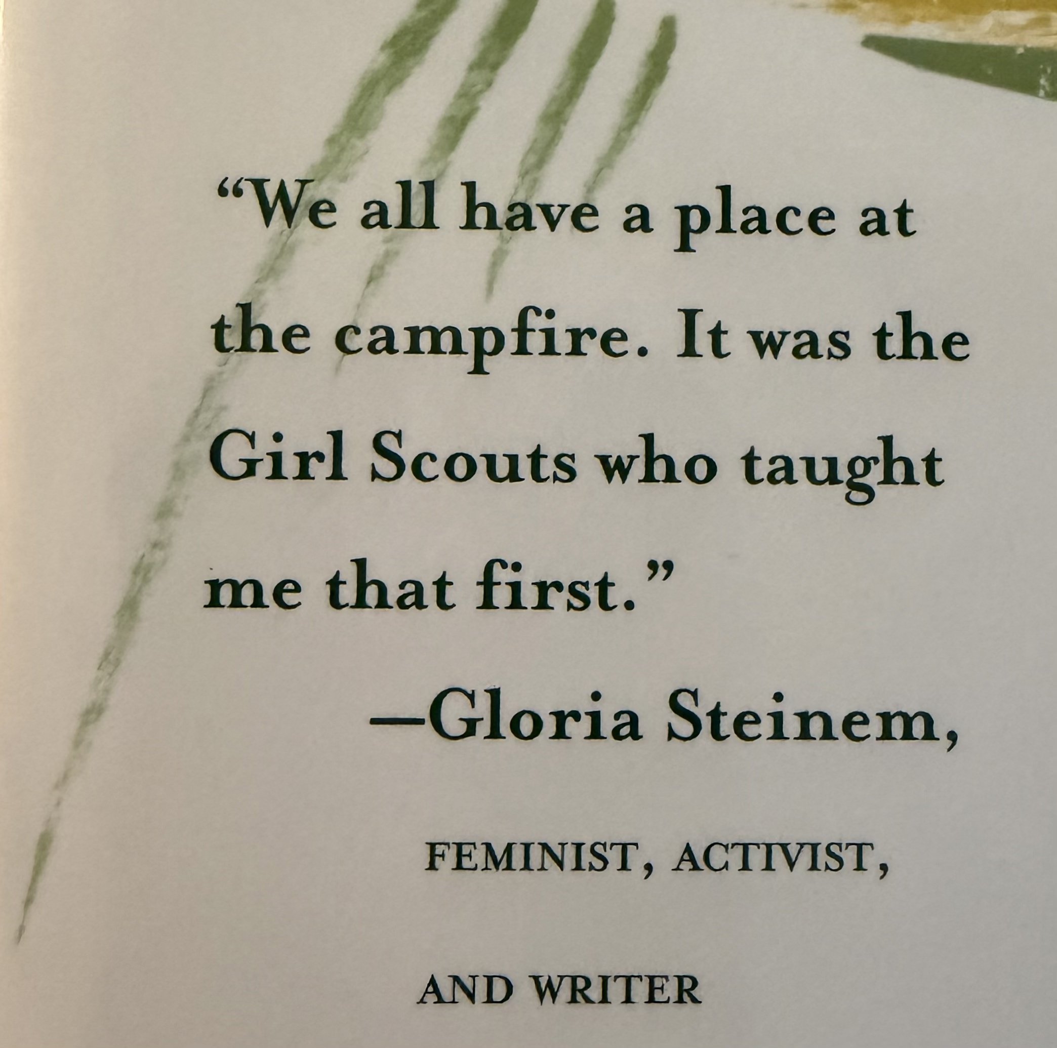 A quote from Gloria Steinem reads: We all have a place at the campfire. It was the Girl Scouts who taught me that first. Gloria Steinem’s name and the words feminist, activist, and writer are below the quote.